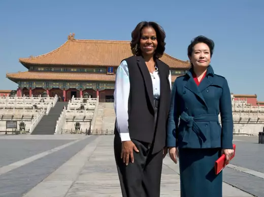 U.S. first lady Michelle Obama and Peng Liyuan, wife of Chinese President Xi Jinping, pose for a photograph as they visit Forbidden City in Beijing on March 21, 2014.