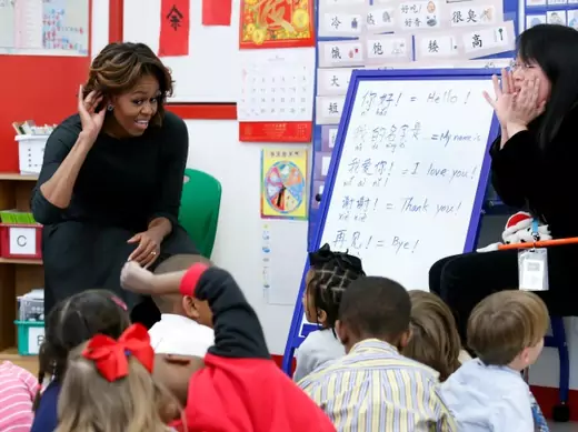 U.S. first lady Michelle Obama (L) participates in a language class with teacher Crystal Chen for pre-school students at the Washington Yu Ying Public Charter School ahead of her upcoming trip to China, in Washington on March 4, 2014. (Yuri Gripas/Courtesy Reuters)