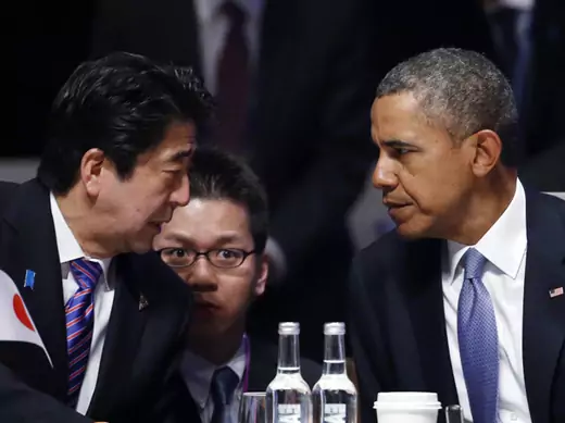 Japan's Prime Minister Shinzo Abe talks to U.S. President Barack Obama during the opening session of the Nuclear Security Summit in The Hague March 24, 2014 (Yves Herman/Courtesy Reuters).