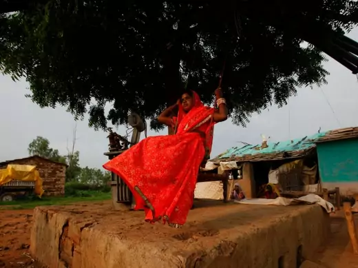 Child bride Krishna, 12, plays on an improvised swing outside her house in a village near Baran, India,  July 2011 (Courtesy Reuters/Danish Siddiqui).