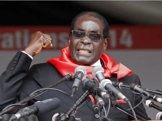 Zimbabwe President Robert Mugabe addresses supporters during celebrations to mark his 90th birthday in Marondera about 80km ( 50 miles) east of the capital Harare, February 23, 2014. 