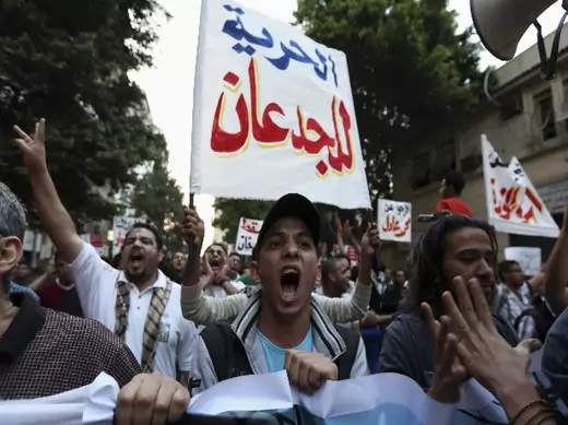 People wave banners in a demonstration in Cairo April 10, 2014 (El Ghany/Courtesy Reuters).