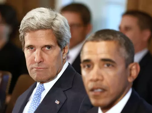 U.S. secretary of state John Kerry listens to U.S. president Barack Obama (Downing/Courtesy Reuters).