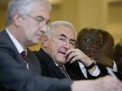 International Monetary Fund's (IMF) Managing Director Dominique Strauss-Kahn listens along side Tony Venables (L), Chief Economist for Department for International Development (DFID), and Remi Babalola (R), Nigerian Minister of State, at a workshop at the Trancorp Hilton in Abuja, Nigeria February 27, 2008.