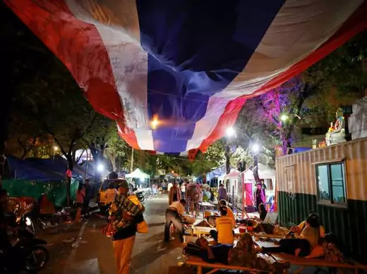 Anti-government protesters get ready to leave their main encampment after a military coup was declared in Bangkok on May 22, 2014 (Damir Sagolj/Courtesy Reuters). 