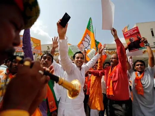 Supporters of India's Bharatiya Janata Party (BJP) celebrate on March 16, 2014, after learning of poll results showing Narendra Modi of the BJP as the next leader of the world’s largest democracy (Amit Dave/Courtesy Reuters).