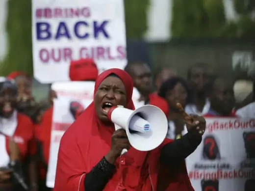 A protester addresses the "Bring Back Our Girls" protest group as they march to the presidential villa to deliver a protest letter to Nigeria's President Goodluck Jonathan in Abuja, calling for the release of the Nigerian schoolgirls in Chibok who were kidnapped by Islamist militant group Boko Haram, May 22, 2014. (Afolabi Sotunde/Courtesy Reuters)