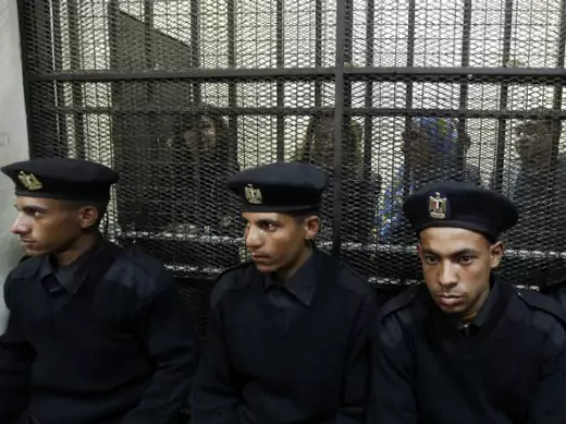 Egyptian activists accused of working for outlawed non-governmental organizations stand trial in Cairo in February 2014.