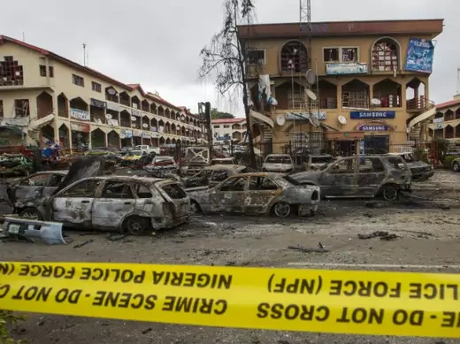 The scene of a bombing at the Emab business centre is pictured filled with wreckages of burnt cars, at the business district in Abuja June 26, 2014. (Afolabi Sotunde/Courtesy Reuters)