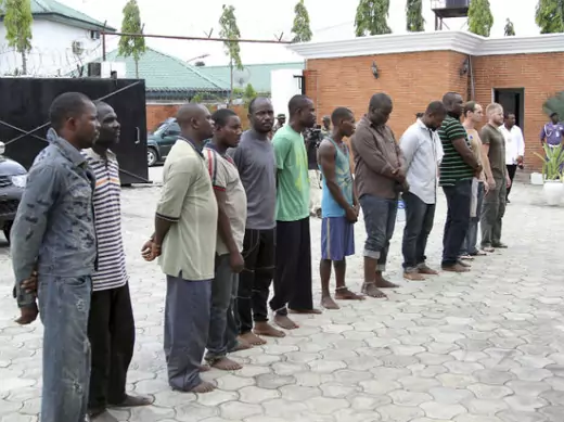 Men suspected to be involved in oil theft are paraded to the media at a military base in Yenagoa, March 28, 2014. (Stringer/Courtesy Reuters)