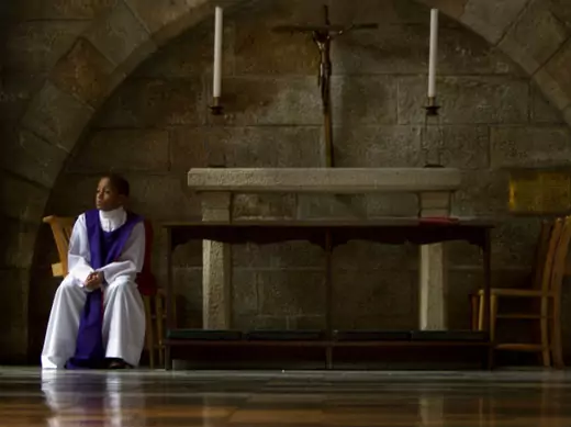 Anglican altar server Akin Ajayi, eleven, waits in the church as people attend a special Sunday morning service dedicated to Nelson Mandela at St. George's Cathedral in Cape Town, December 8, 2013. (Mark Wessels/Courtesy Reuters)