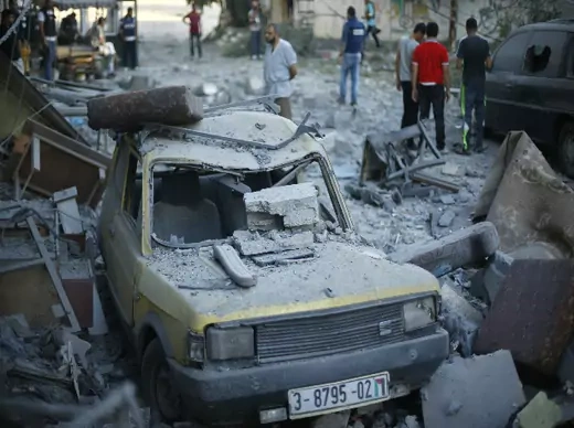 A car, which police said was damaged in an Israeli air strike that targeted the house of top Hamas political leader Mahmoud Zahar, is seen in Gaza City July 16, 2014 (Salem/Courtesy Reuters).