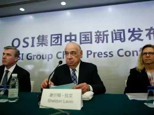 OSI Group Chairman and CEO Sheldon Lavin (C), OSI Group President and Chief Operating Officer David McDonald (L) and OSI Vice President of North America Quality Sharon Birkett attend a news conference in Shanghai, July 28, 2014. An on-going internal investigation conducted by OSI Group LLC into its unit, the scandal-hit Chinese food supplier Shanghai Husi Food Co Ltd, has revealed that standards were below par. The firm will also spend 10 million yuan ($1.62 million) over three years to launch a food safet