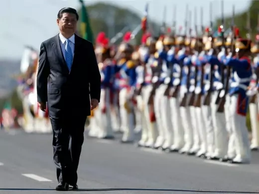 China's President Xi Jinping reviews an honor guard before a meeting with Brazilian President Dilma Rousseff on the sidelines of the 6th BRICS summit at the Planalto Palace in Brasilia July 17, 2014. REUTERS/Sergio Moraes (BRAZIL - Tags: POLITICS MILITARY)