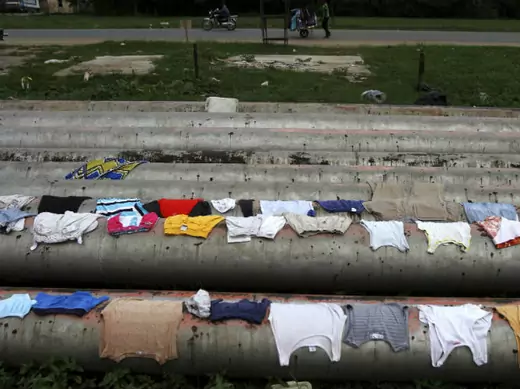 Local residents' clothes dry over the gas pipelines running through the Eleme community near the city of Port Harcourt, a major Nigerian oil hub in the country's southeast.