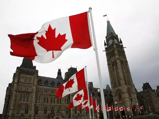 Canadian flags line the road around Parliament Hill during the National Day of Honour ceremony in Ottawa