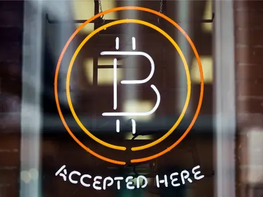 A Bitcoin sign is seen in a window in Toronto, Canada, May 2014 (Courtesy Reuters/Mark Blinch). 