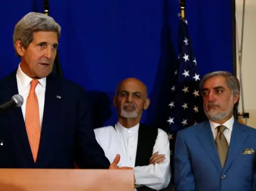 U.S. Secretary of State John Kerry speaks next to Afghan presidential candidates Ashraf Ghani Ahmadzai and Abdullah Abdullah in Kabul, Afghanistan, following the signing of a deal to form a national unity government (Courtesy Reuters/Omar Sobhani). 
