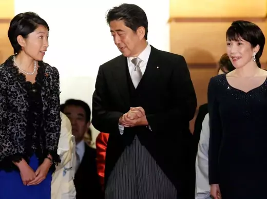 Japan's Prime Minister Shinzo Abe (C) talks with Economy, Trade and Industry Minister Yuko Obuchi (L) and Internal Affairs and Communications Minister Sanae Takaichi as they prepare for a photo session at his official residence in Tokyo on September 3, 2014. (Toru Hanai/Courtesy Reuters)