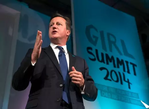 Britain's Prime Minister David Cameron speaks at the Girl Summit in London, July 22, 2014. The prime minister announced that Britain is to make it compulsory for teachers and health workers to report cases of female genital mutilation (Courtesy Reuters/Oli Scarff/Pool). 