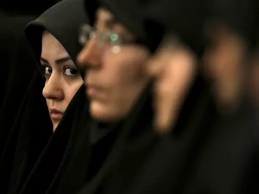 A religious activist looks on while attending the Twenty-Fifth International Islamic Unity Conference in Tehran, Iran, February 2012 (Courtesy Reuters/Morteza Nikoubazl).