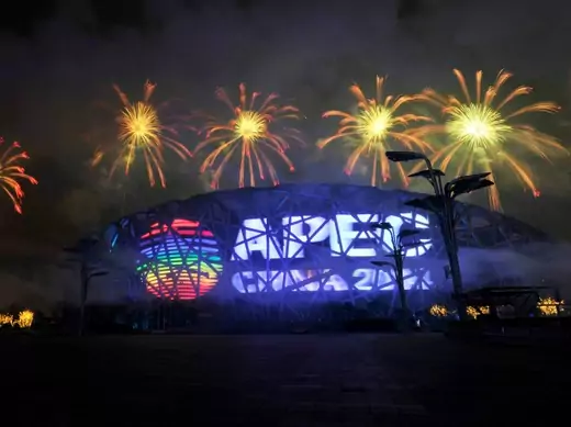 Fireworks explode over a screen displaying the APEC logo on the National Stadium, or the "Bird's Nest", during a rehearsal for the opening of the APEC Summit in Beijing, November 4, 2014. Picture taken November 4, 2014. REUTERS/Stringer (CHINA - Tags: POLITICS BUSINESS) CHINA OUT.nest