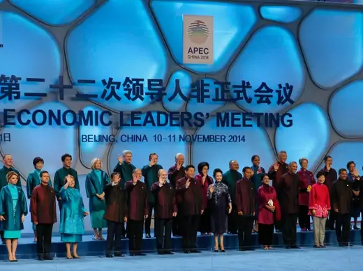 Asia Pacific Economic Cooperation (APEC) nations' leaders and spouses pose for a family photo in Beijing November 10, 2014. REUTERS/Kevin Lamarque (CHINA - Tags: POLITICS)
