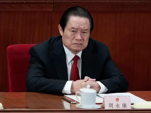 China's former Politburo Standing Committee Member Zhou Yongkang attends the closing ceremony of the National People's Congress (NPC) at the Great Hall of the People in Beijing March 14, 2012. China's senior leadership has agreed to open a corruption investigation into Zhou, one of China's most powerful politicians in the past decade, stepping up its anti-graft campaign, the South China Morning Post reported on August 30, 2013. Picture taken March 14, 2012. REUTERS/Jason Lee (CHINA - Tags: POLITICS BUSINES