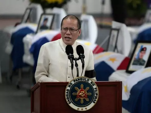 Philippine President Benigno Aquino delivers a speech in front of the caskets of the slain members of the Special Action Force (SAF) who were killed in Sunday's clash with Muslim rebels, during a service inside a police headquarters in Taguig city, south of Manila January 30, 2015. Aquino urged legislators on Wednesday not to abandon a plan for autonomy for Muslims to end a decades-old insurgency after the clash in which dozens of people were killed, saying doing so would dash hopes for peace. A top offici
