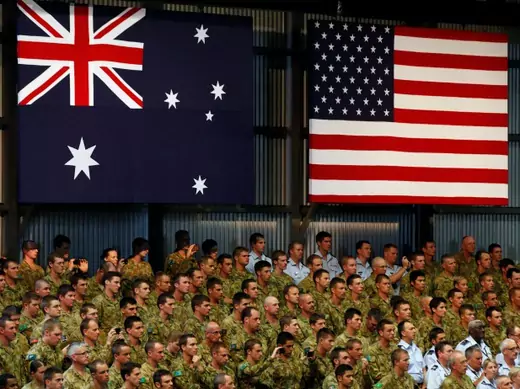 Troops watch U.S. President Barack Obama talk to U.S. Marines and Australian troops at the RAAF Base in Darwin, November 17, 2011. REUTERS/Larry Downing (AUSTRALIA - Tags: POLITICS MILITARY)