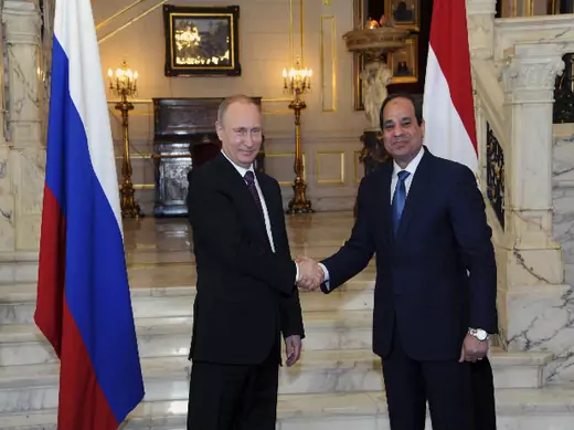 Russia's President Vladimir Putin (L) shakes hands with Egypt's President Abdel Fattah al-Sisi during a meeting in Cairo February 10, 2015 (Klimentyev/Courtesy Reuters).