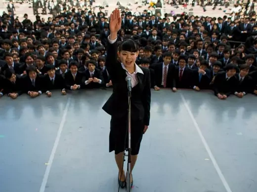Japanese college graduates attend a pep rally in Tokyo designed to boost their morale as they break into the job market, February 2015 (Thomas Peter/Reuters). 
