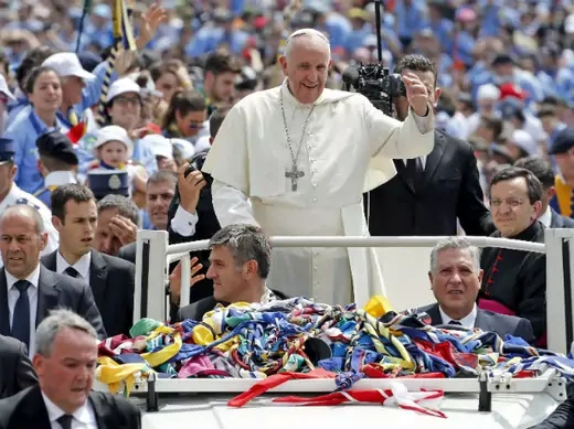 Pope Francis waves to a crowd on St. Peter's Square in Vatican City on June 13, 2015.