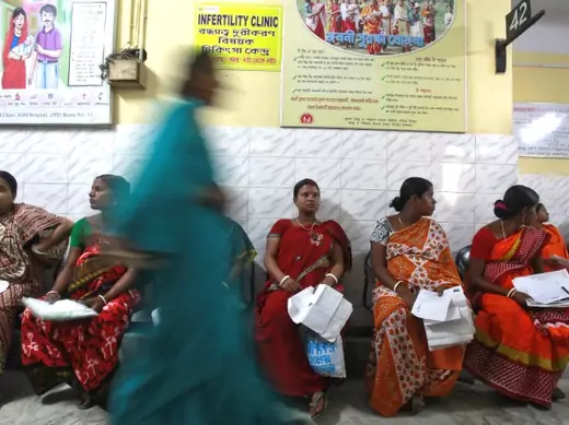 Pregnant women holding their prescription papers wait to be examined at a government-run hospital in the northeastern Indian city of Agartala March 17, 2015. India is betting on cheap mobile phones to cut some of the world's highest rates of maternal and child deaths, as it rolls out a campaign of voice messages delivering health advice to pregnant women and mothers. Amid a scarcity of doctors and public hospitals, India is relying on its mobile telephone network, the second largest in the world with 950 m
