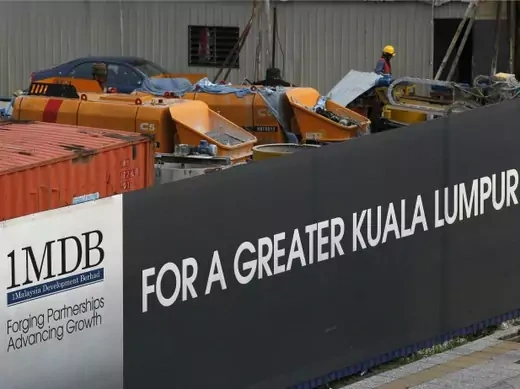 Workmen are pictured on site at the 1 Malaysia Development Berhad (1MDB) flagship Tun Razak Exchange development in Kuala Lumpur, Malaysia, March 1, 2015. Malaysian Prime Minister Najib Razak slammed a report that said close to $700 million was wired to his personal account from banks, government agencies and companies linked to the debt-laden state fund 1MDB, claiming this was a "continuation of political sabotage." Picture taken March 1, 2015. REUTERS/Olivia Harris
