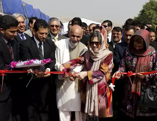 Afghan President Ashraf Ghani cuts a ribbon with his wife Rula Ghani during a ceremony to mark the International Day of Rural Women at Badam Bagh area in Kabul