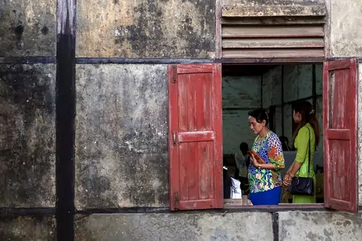 Woman is seen at a polling station while casting her vote during the general election in Sittwe