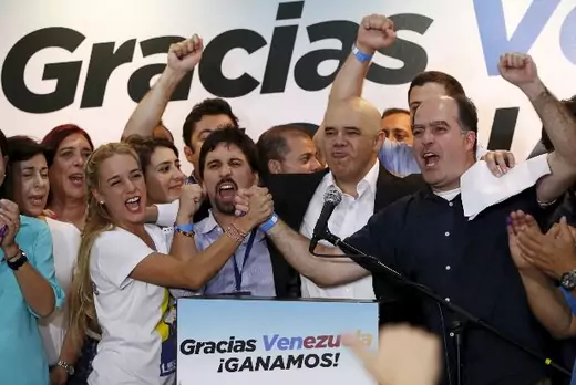 Lilian Tintori (centre L), wife of jailed Venezuelan opposition leader Leopoldo Lopez, celebrates next to candidates of the Venezuelan coalition of opposition parties (MUD) during a news conference on the election in Caracas early December 7, 2015. Venezuela's opposition won control of the legislature from the ruling Socialists for the first time in 16 years on Sunday, giving them a long-sought platform to challenge President Nicolas Maduro (Reuters/Carlos Garcia Rawlins).