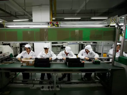 Workers are seen inside a Foxconn factory in the township of Longhua in the southern Guangdong province May 26, 2010. A spate of nine employee deaths at global contract electronics manufacturer Foxconn, Apple's main supplier of iPhones, has cast a spotlight on some of the harsher aspects of blue-collar life on the Chinese factory floor (Reuters/Bobby Yip).