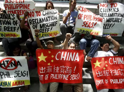 Filipino activists protest Chinese reclamation in the South China Sea outside the Chinese embassy in Manila on April 17, 2015.