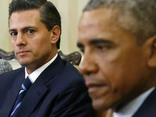 Mexican President Enrique Peña Nieto looks toward U.S. President Barack Obama during their meeting at the White House in Washington, DC, on January 6, 2015.