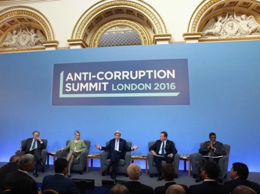 British Prime Minister Cameron is joined by Jim Yong Kim, President of the World Bank Group, (left) Sarah Chayes, a senior associate in the Democracy and Rule of Law Program, (second left) US Secretary of State John Kerry, (third from left) and Nigerian President Muhammadu Buhari, (right), as he opens the international anti-corruption summit on May 12, 2016 in London, England. Leaders from many of the worlds nations are gathering in London for the summit, which is aimed at stepping up action to tackle the 