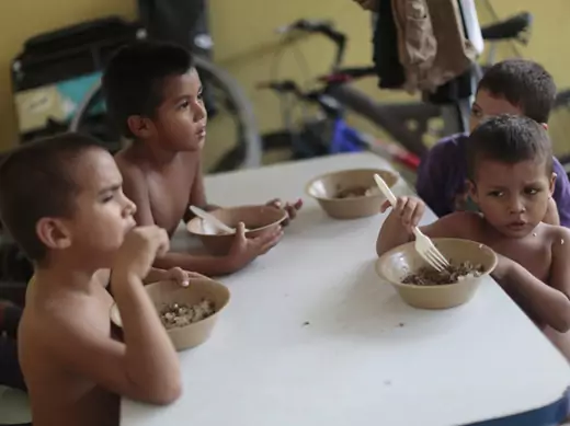 Children from Honduras have their meals at the Todo por ellos immigrant shelter in Tapachula