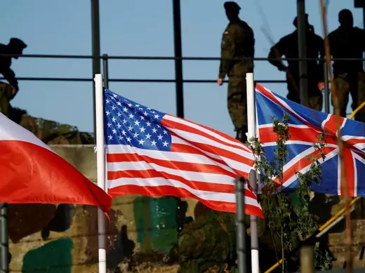 Polish, U.S., and British flags are seen during the NATO allies' Anakonda 16 exercise near Torun, Poland, on June 7, 2016.