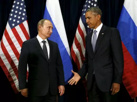 U.S. President Barack Obama extends his hand to Russian President Vladimir Putin during their meeting at the United Nations General Assembly in New York on September 28, 2015.