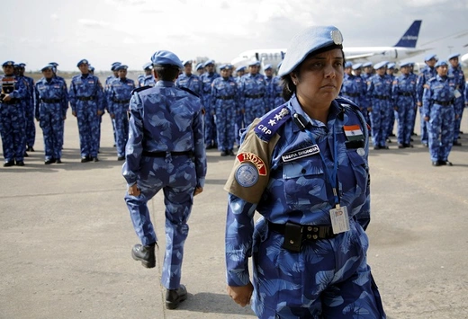 The first all-female unit of United Nations peacekeepers stand at attention as they arrive in Monrovia
