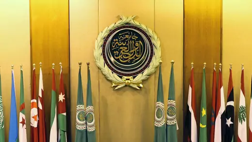 Flag of Arab League member states accompany the league's seal