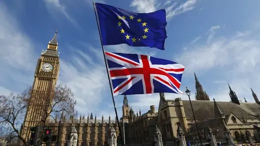 EU and UK flags fly during a pro-EU march in front of the British Parliament in London.