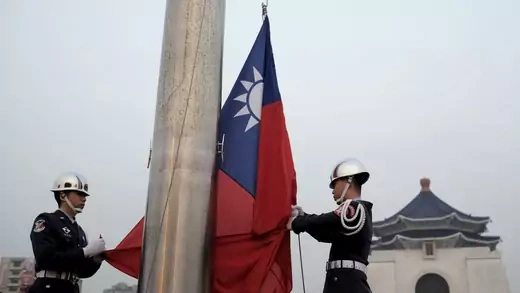 Military honor guards lower the Taiwanese flag, at Liberty Square, in Taipei, Taiwan.