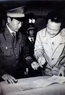 Chinese dissident Wei Jingsheng signs a release document in 1993. Xinhua/AP
